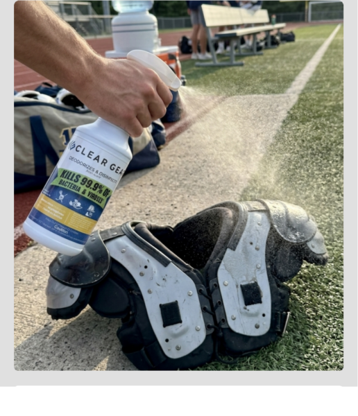 spraying Clear Gear disinfectant on football shoulder pads